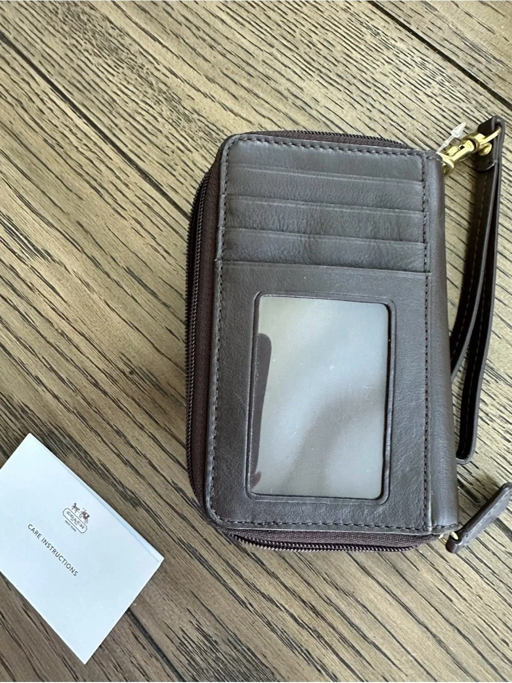Coach Dark Brown Leather Wristlet Phone Case with Gold Turnlock